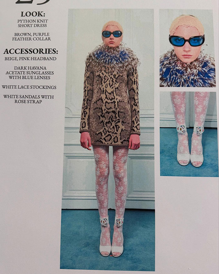 Trans model debuts at Paris Fashion Week in python dress, feather collar, lace stockings, and blue lens sunglasses. Trans model debuts at Paris Fashion Week in python dress, feather collar, lace stockings, and blue lens sunglasses.