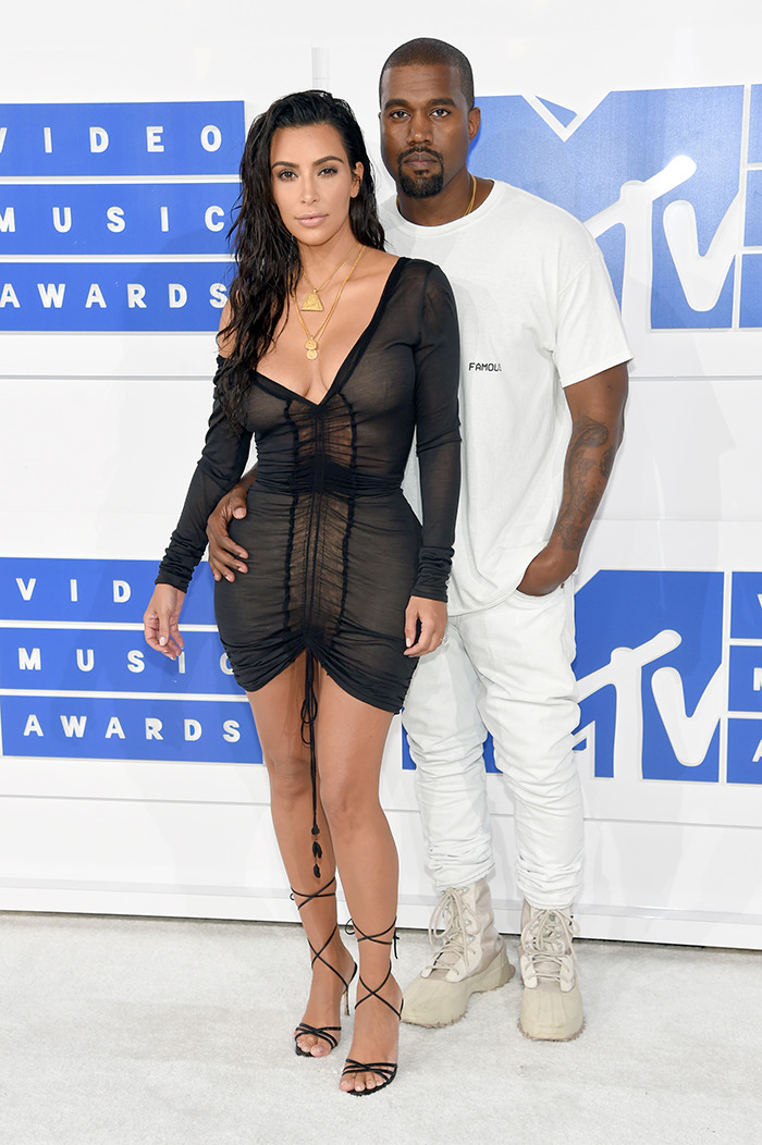 Kanye West and Kim Kardashian at MTV Video Music Awards. Kanye West and Kim Kardashian at MTV Video Music Awards.