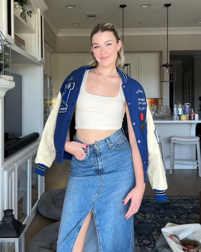 Woman in a trendy outfit with a blue jacket and denim skirt, sparking debate on the "hottest" fashion choice. Woman in a trendy outfit with a blue jacket and denim skirt, sparking debate on the "hottest" fashion choice.