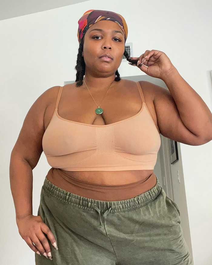 Person in casual attire, promoting acceptance and body positivity, highlights obesity celebration. Person in casual attire, promoting acceptance and body positivity, highlights obesity celebration.