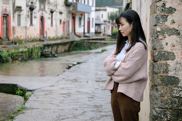 Bridesmaid pensive by a canal, contemplating her decision to leave a wedding. Bridesmaid pensive by a canal, contemplating her decision to leave a wedding.