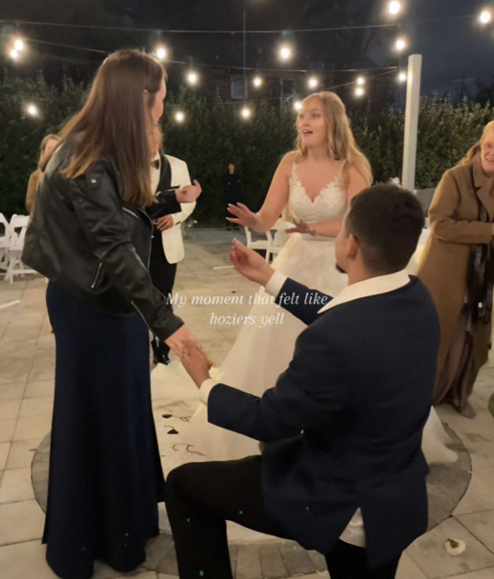 Man proposing at a wedding, sparking reactions; bride appears surprised in elegant gown. Man proposing at a wedding, sparking reactions; bride appears surprised in elegant gown.