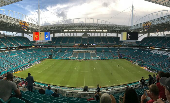 Panoramic view of a large soccer stadium filled with fans, showcasing one of the iconic cathedrals of soccer.