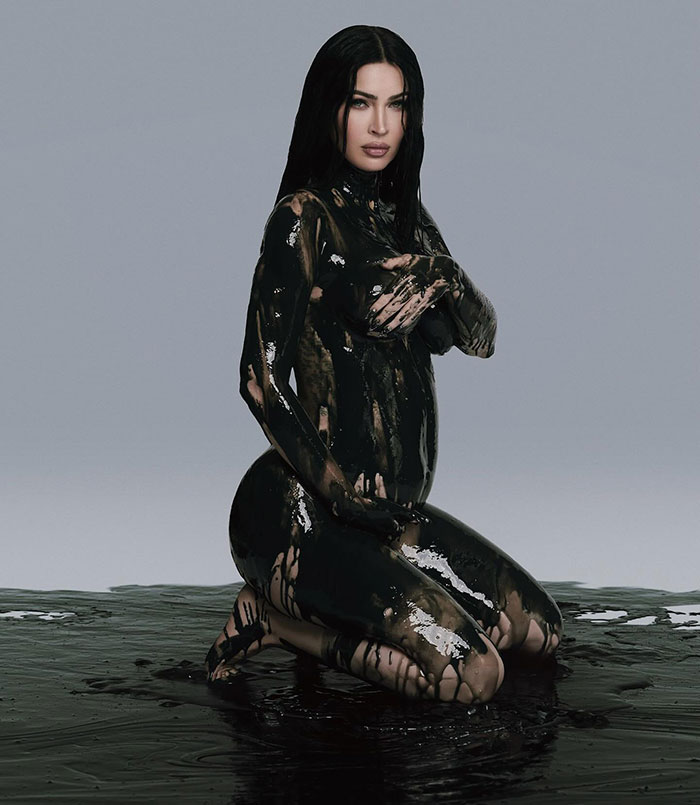 Person covered in black paint, kneeling in a studio setting, related to Celestial Seed announcement. Person covered in black paint, kneeling in a studio setting, related to Celestial Seed announcement.