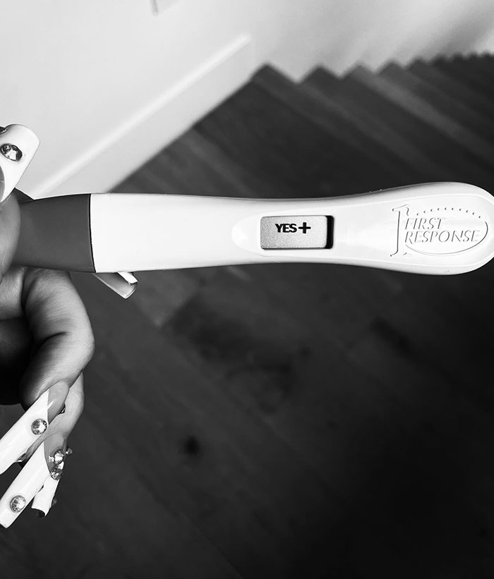 Positive pregnancy test held by a person, suggesting a celestial seed announcement. Positive pregnancy test held by a person, suggesting a celestial seed announcement.