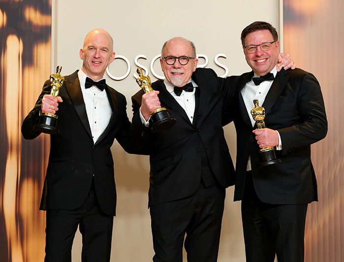 Oscars Best Sound winners tuxedos holding Oscars trophies, celebrating a win at the Oscars. Oscars Best Sound winners tuxedos holding Oscars trophies, celebrating a win at the Oscars.