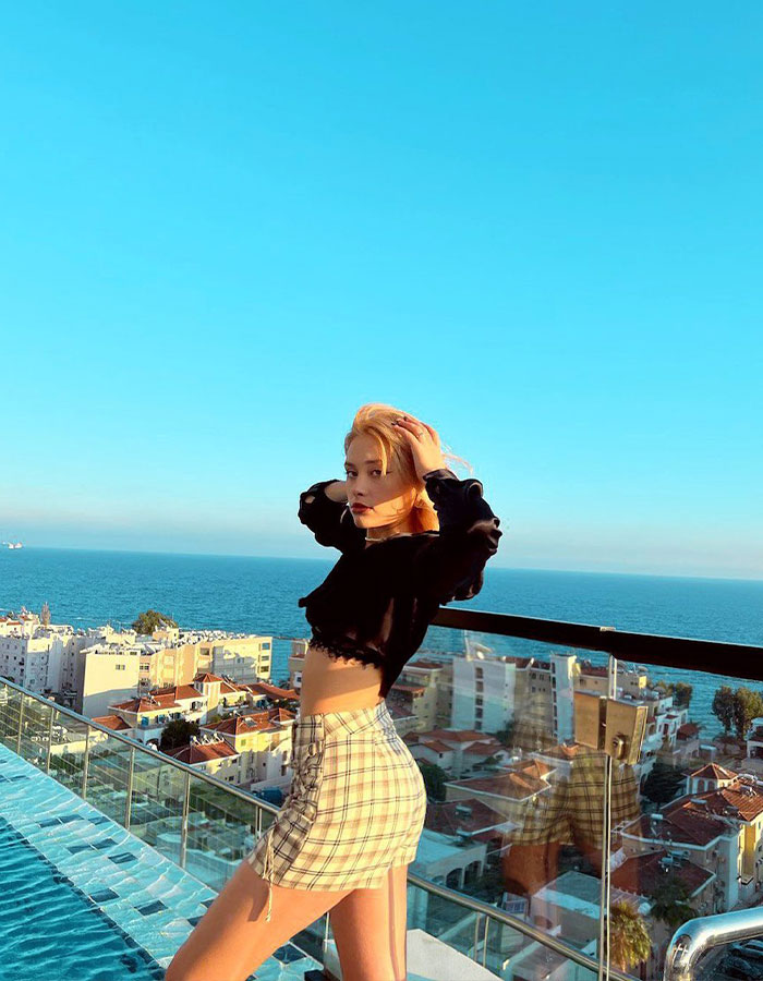 Model posing on a rooftop overlooking the sea, related to "Porta Potty" party trafficking investigation. Model posing on a rooftop overlooking the sea, related to "Porta Potty" party trafficking investigation.