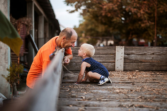 A father and toddler interact playfully outdoors, illustrating a parenting expert's insights on overcoming fears. A father and toddler interact playfully outdoors, illustrating a parenting expert's insights on overcoming fears.