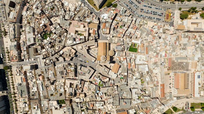 Aerial view of a city with intricate street patterns, showcasing pro navigator skills. Aerial view of a city with intricate street patterns, showcasing pro navigator skills.