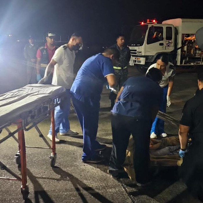 Emergency responders at night scene of tragic plane crash near remote island. Emergency responders at night scene of tragic plane crash near remote island.