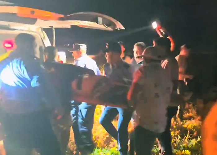 Rescue team carrying victim from tragic plane crash near remote island. Rescue team carrying victim from tragic plane crash near remote island.