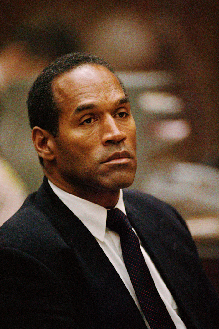 Man in a suit with a serious expression, related to O.J. Simpson's case investigation claims. Man in a suit with a serious expression, related to O.J. Simpson's case investigation claims.