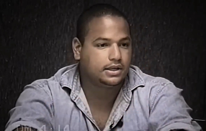 A man in a denim shirt speaks seriously, linked to claims about O.J. Simpson's son being the real culprit. A man in a denim shirt speaks seriously, linked to claims about O.J. Simpson's son being the real culprit.