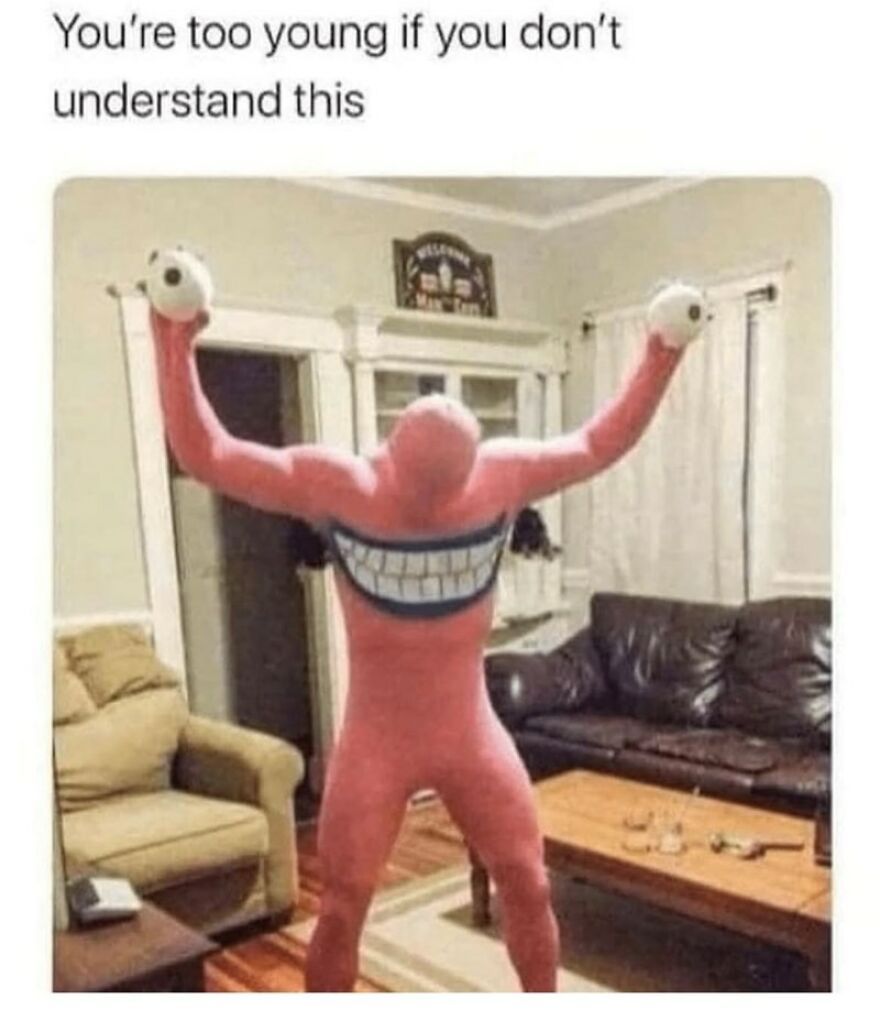 Person in a pink costume with a cartoonish smile, holding eyeballs, in a living room, part of funny memes collection.