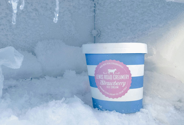 Lewis Road Creamery strawberry ice cream in a frosty freezer setting. Lewis Road Creamery strawberry ice cream in a frosty freezer setting.