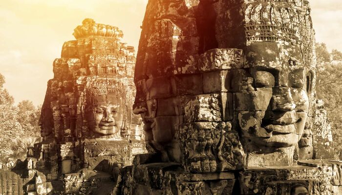 Ancient stone faces of a forgotten place, illuminated by sunlight, evoking mystery and history. Ancient stone faces of a forgotten place, illuminated by sunlight, evoking mystery and history.