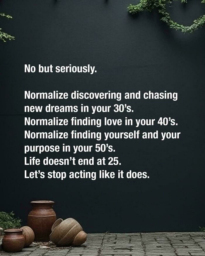 Text on wall encouraging adults to embrace new dreams, love, and purpose at any age, with a decorative plant and pots below.