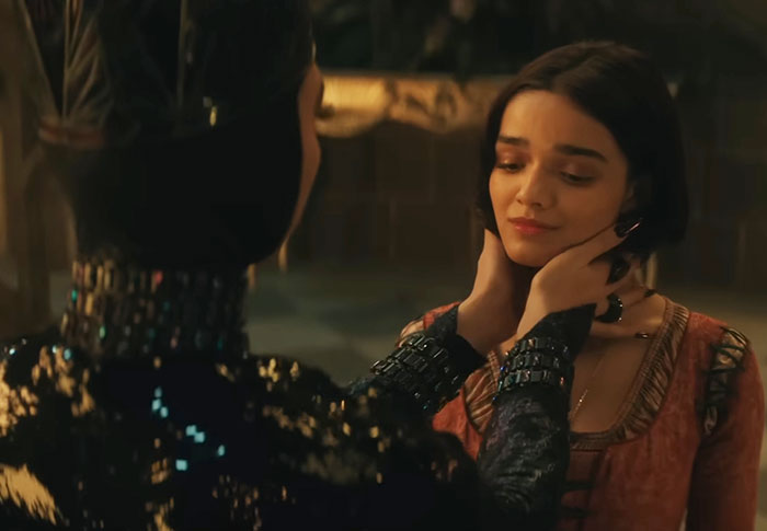 Scene from 'Snow White' showing two characters in a dramatic moment. Scene from 'Snow White' showing two characters in a dramatic moment.