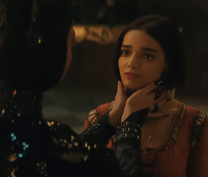 A dramatic scene from Disney's Snow White, featuring intense expressions and dark, atmospheric lighting. A dramatic scene from Disney's Snow White, featuring intense expressions and dark, atmospheric lighting.