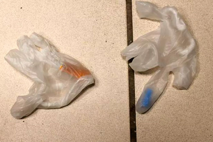 Plastic gloves found after woman discovers co-worker spiking her Coke with spy cam help. Plastic gloves found after woman discovers co-worker spiking her Coke with spy cam help.