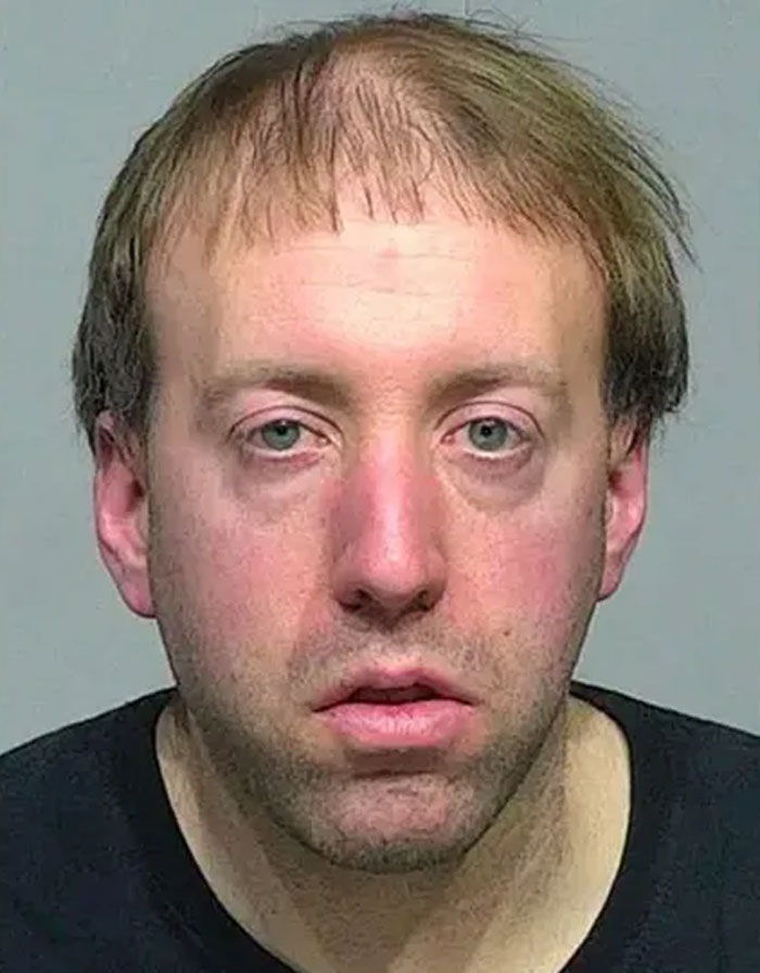 A man involved in co-worker's Coke can incident, highlighted by a spy cam. A man involved in co-worker's Coke can incident, highlighted by a spy cam.