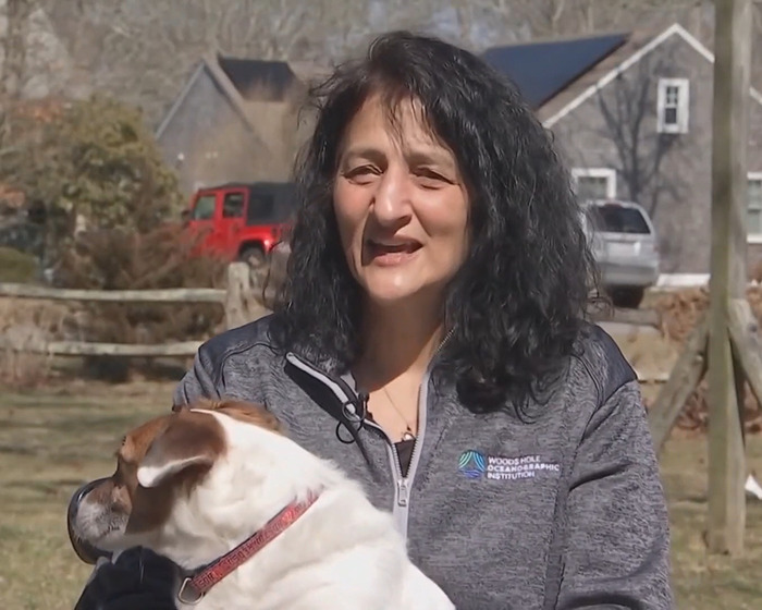 A woman outside with a dog, related to NASA astronaut's psychological trauma experience. A woman outside with a dog, related to NASA astronaut's psychological trauma experience.