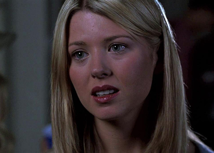 Blonde woman with straight hair at a movie premiere, related to American Pie. Blonde woman with straight hair at a movie premiere, related to American Pie.