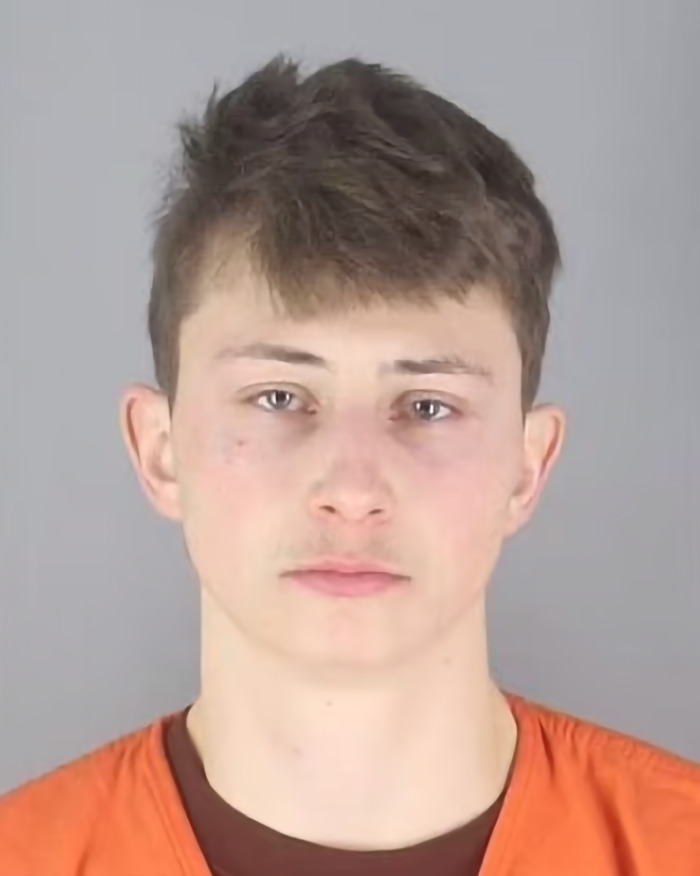 Conner Michael Iversen's mugshot wearing an orange outfit. Conner Michael Iversen's mugshot wearing an orange outfit.