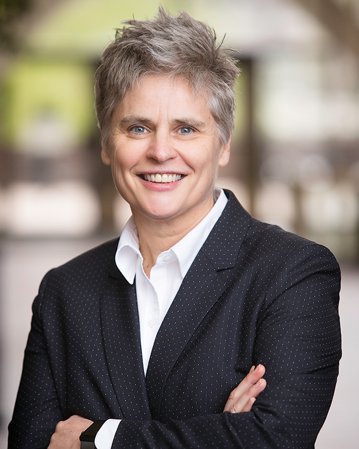 District Attorney Mary Moriarty in a suit, standing outdoors. District Attorney Mary Moriarty in a suit, standing outdoors.