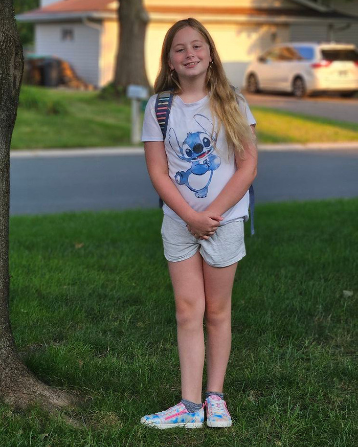 Lilyana Loycano standing on grass wearing a Stitch shirt. Lilyana Loycano standing on grass wearing a Stitch shirt.