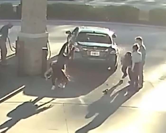 Girl in prom dress body slams suspect at gas station amid brawl, captured in viral video. Girl in prom dress body slams suspect at gas station amid brawl, captured in viral video.