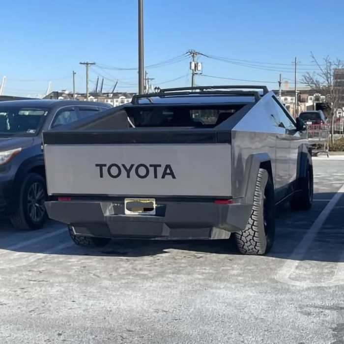Tesla altered to display Toyota logo in parking lot, reflecting Elon Musk controversy concerns. Tesla altered to display Toyota logo in parking lot, reflecting Elon Musk controversy concerns.