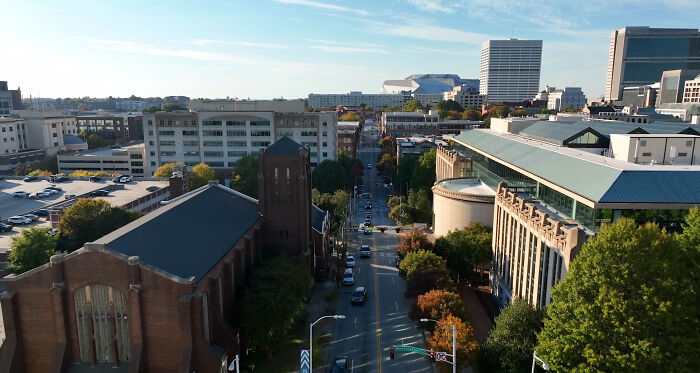 Aerial view of a cityscape with greenery and buildings, a spot noted by seasoned travelers as not worth the hype.