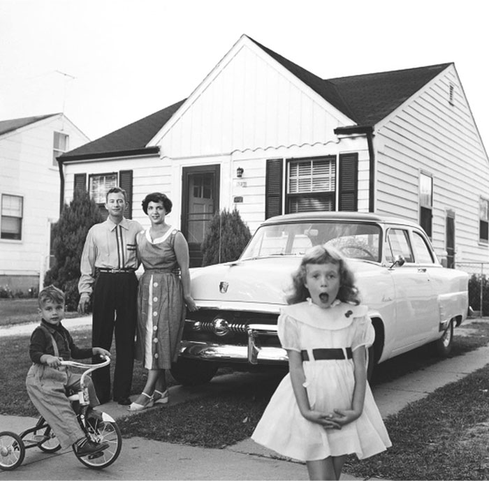 Vintage American family with car outside home, showcasing past everyday life. Vintage American family with car outside home, showcasing past everyday life.