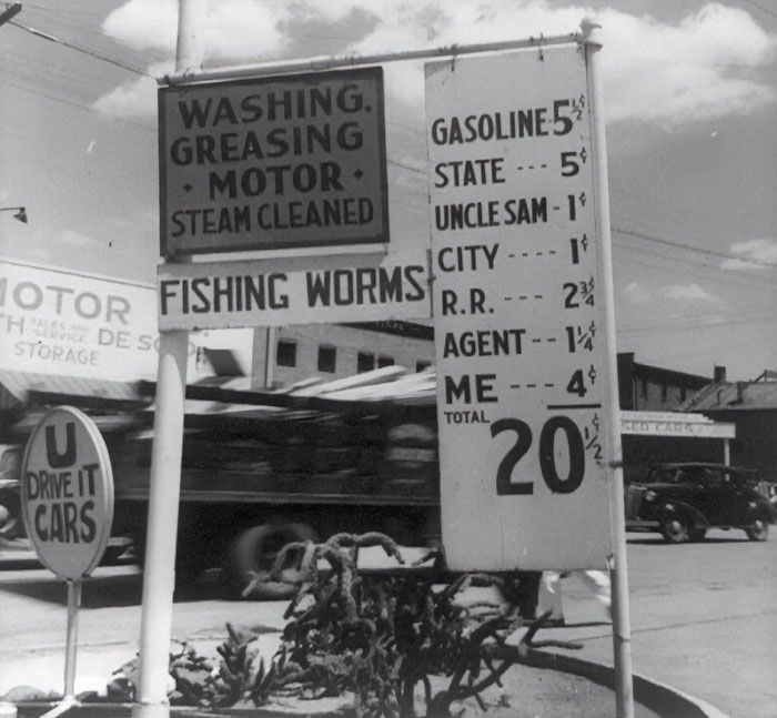 Vintage gas station sign showing 1940s prices, showcasing everyday American life in the past. Vintage gas station sign showing 1940s prices, showcasing everyday American life in the past.