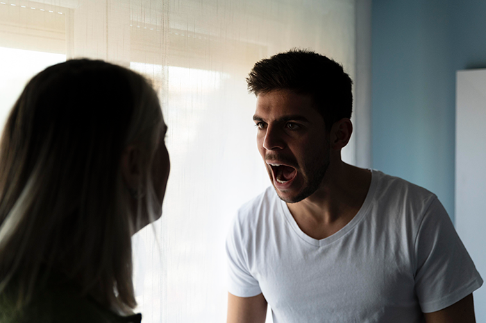 Man arguing with a woman, expressing the loss of trust and grief over their dog's sudden absence. Man arguing with a woman, expressing the loss of trust and grief over their dog's sudden absence.