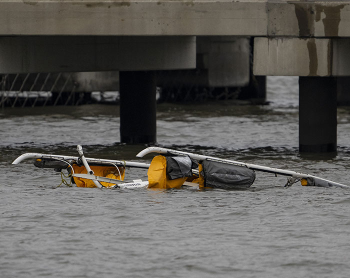 Wreckage of NYC helicopter in water under bridge following fatal crash. Wreckage of NYC helicopter in water under bridge following fatal crash.