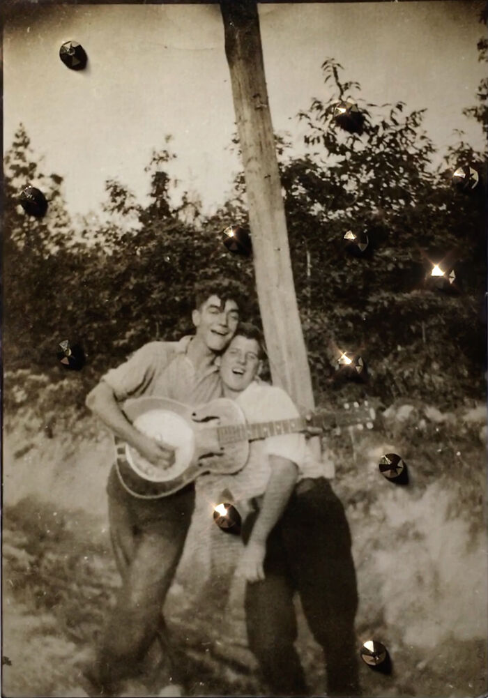 Two people joyfully playing guitar outdoors, representing love without boundaries.