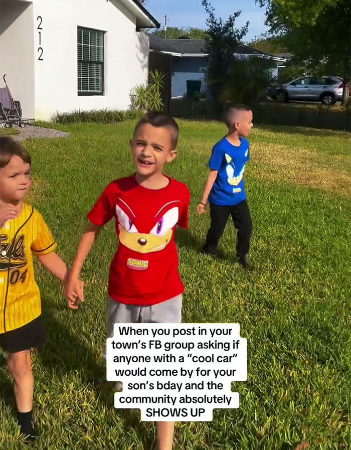 Children playing outside as community surprises a boy with sports cars for his birthday. Children playing outside as community surprises a boy with sports cars for his birthday.