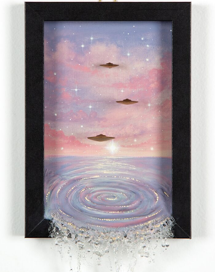 Alien diorama with UFOs in a starry sky over a glistening sea, featuring cascading water details from the frame.