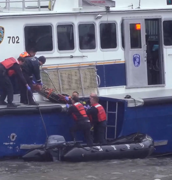 Rescue crew assists after NYC helicopter crash, baffling netizens. Rescue crew assists after NYC helicopter crash, baffling netizens.