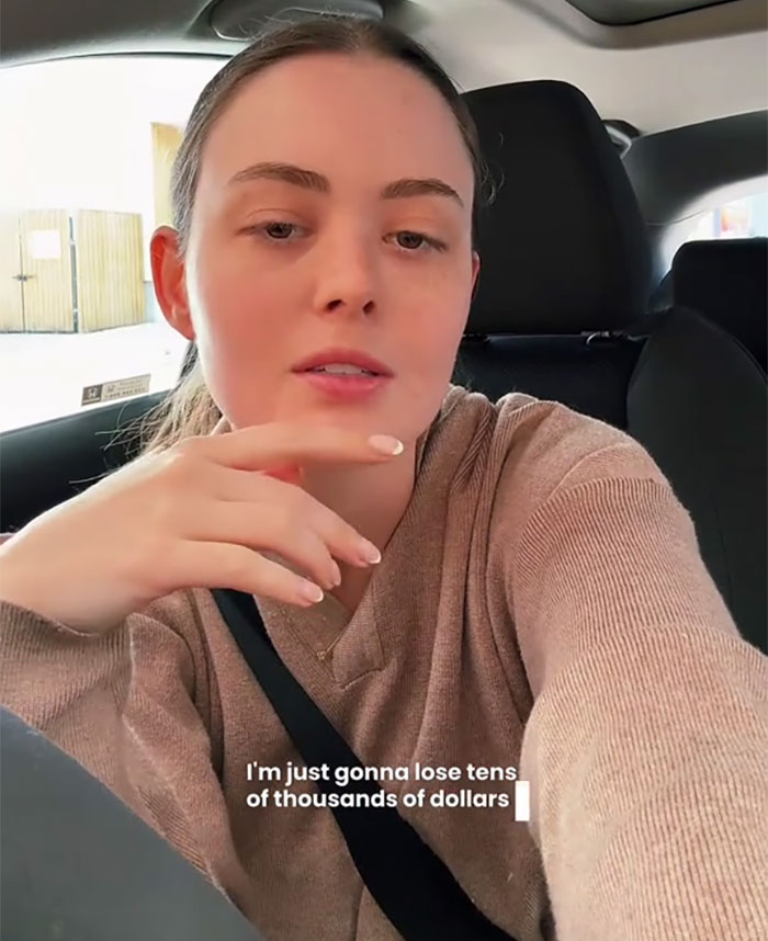 Small business owner in a car discussing the negative impact of new tariffs on her company. Small business owner in a car discussing the negative impact of new tariffs on her company.