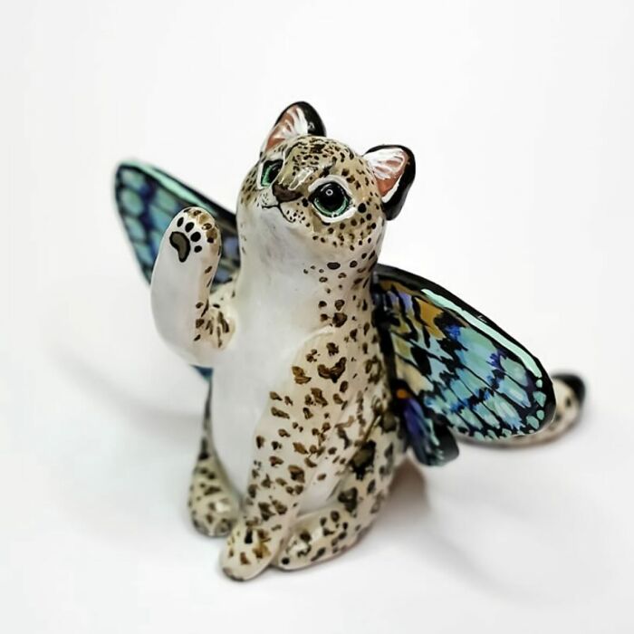 Pocket-sized animal figurine with butterfly wings by Vallavica, featuring a cute leopard-like creature.
