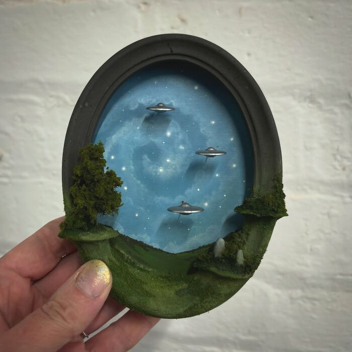 Miniature diorama depicting UFOs in a starry sky, perfect for alien and mystery enthusiasts.