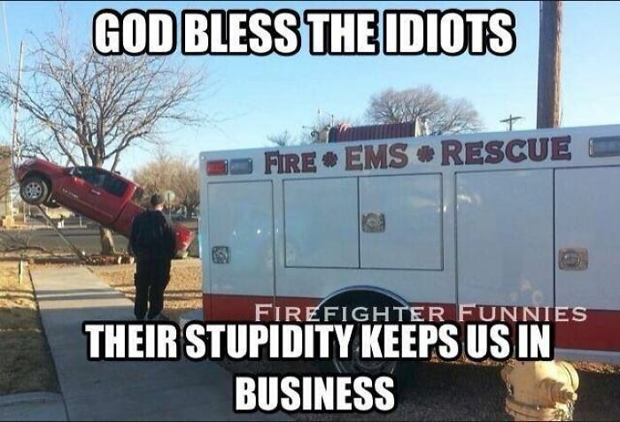 Red truck stuck on pole near fire EMS rescue vehicle with humorous dad joke about stupidity and business.