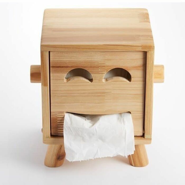 Wooden tissue box holder with a smiling face design, crafted as a creative woodworking project.