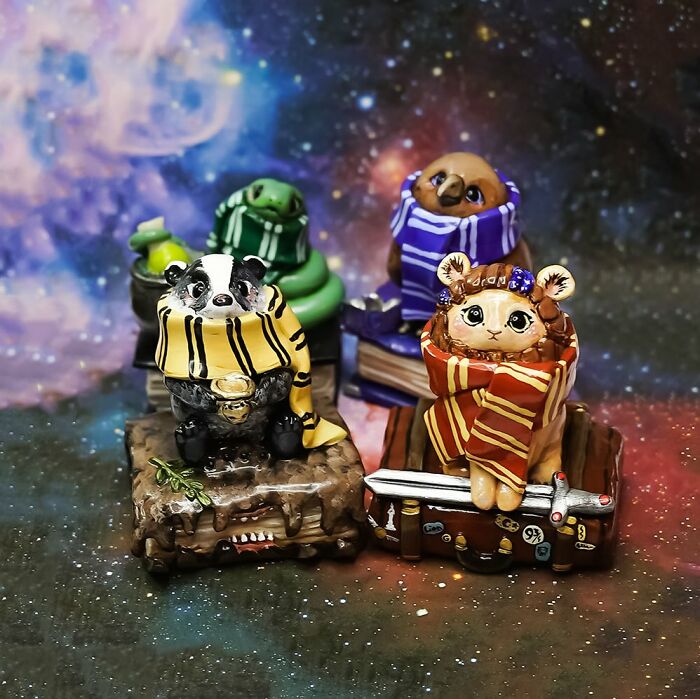 Pocket-sized animal figurines by Vallavica in colorful scarves on a starry background.