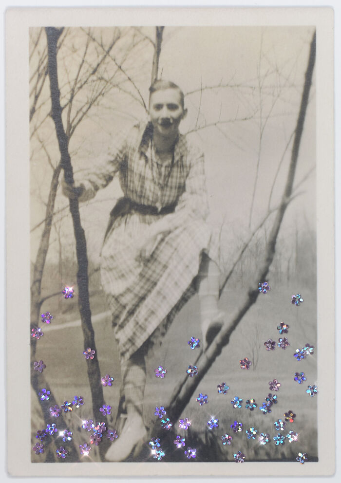 Person in plaid dress perched on a tree, surrounded by decorative flowers, representing a life without boundaries.