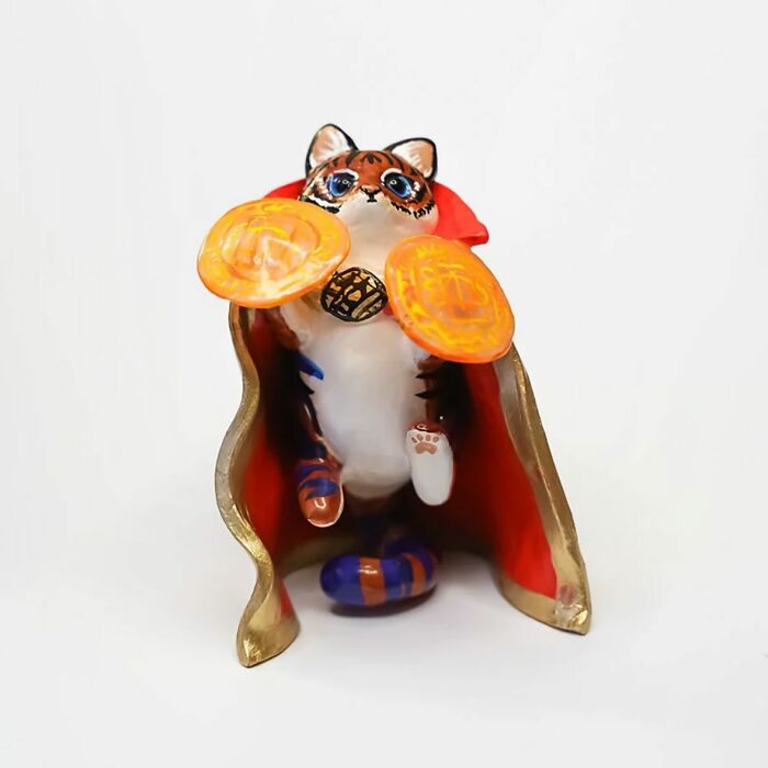 Pocket-sized animal figurine in a superhero costume by Vallavica, showcasing vibrant colors and intricate details.