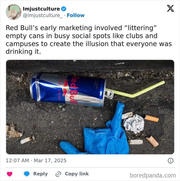 Red Bull can with straw on ground, part of unique marketing strategy.